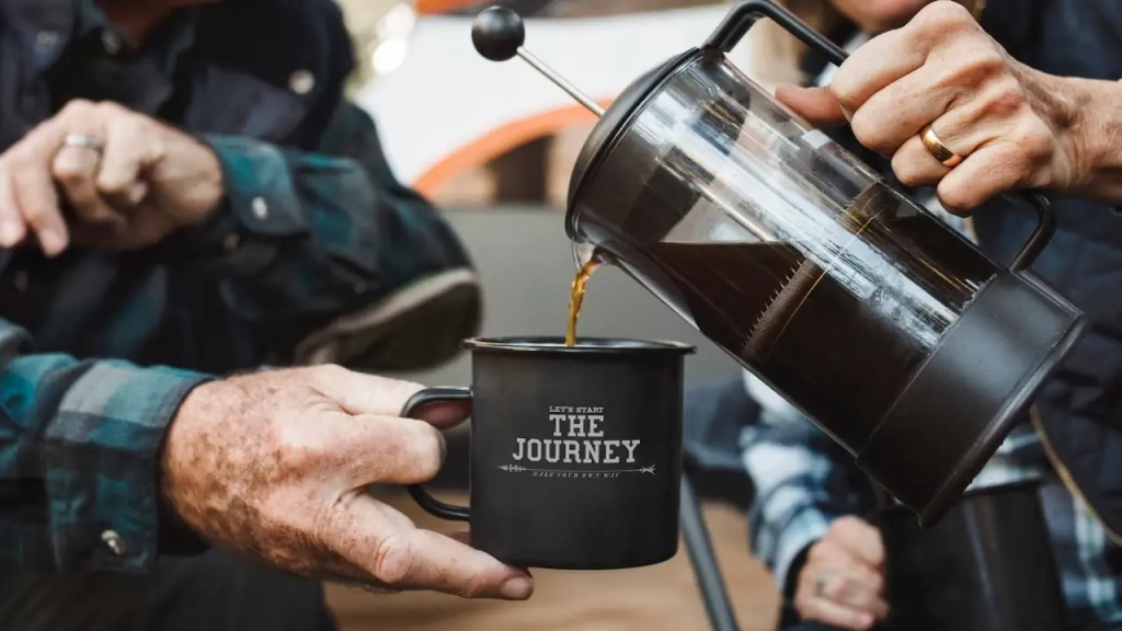 Luxury Camping in Spain filling a cup of coffee